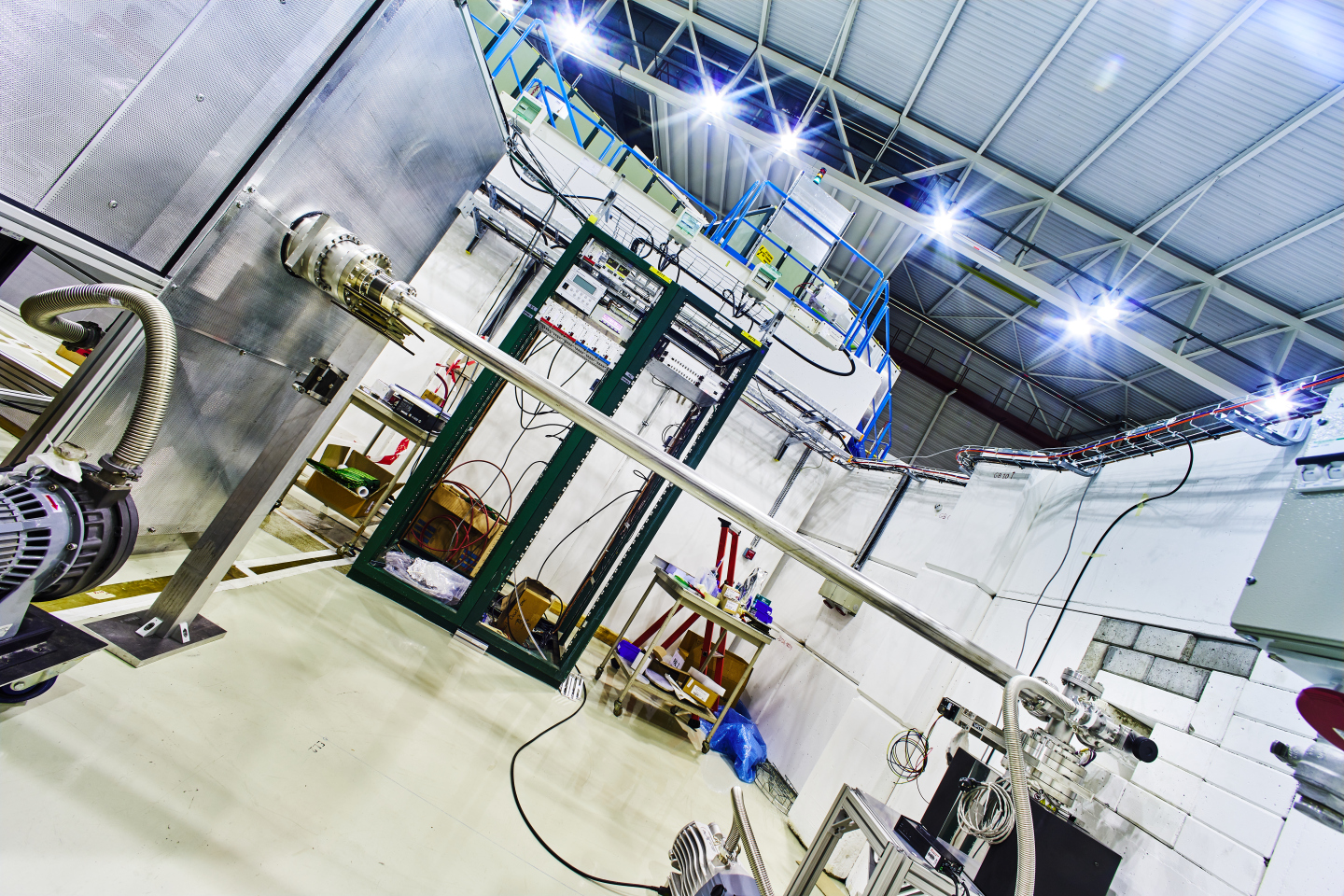 The new transfer line connecting the ELENA ring (behind the wall on the right) to the GBAR experiment (left). (Image: CERN)